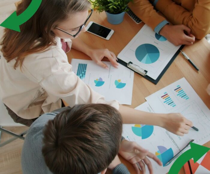 Colleagues working together on sustainability reports